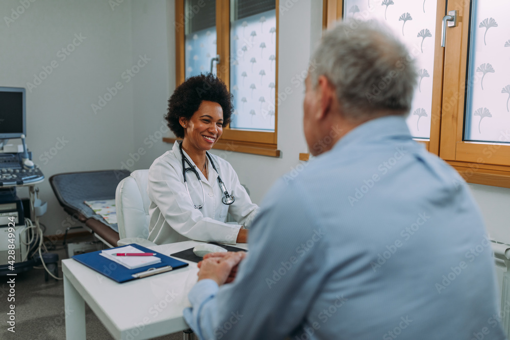 Female doctor examining a senior patient Female doctor examining a senior patient