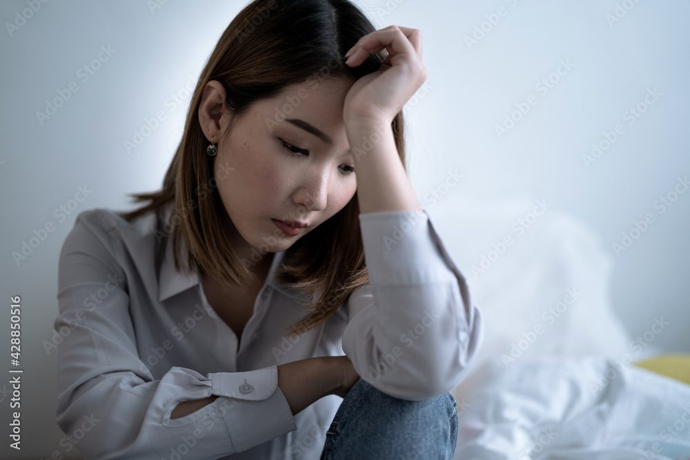 Asian woman is introverted alone in her bedroom, She is lonely and has stress, Depression. Asian woman is introverted alone in her bedroom, She is lonely and has stress, Depression.