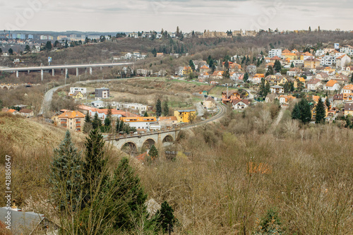 Prague,Czech republic Real estate residential concept.Czech architecture view from above.Panoramic city skyline.Barrandov Bridge and old railway stone bridge in Hlubocepy.Traditional Czech development photo