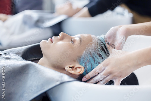 Woman getting her Hair Washed and Massaged in a Beauty Salon