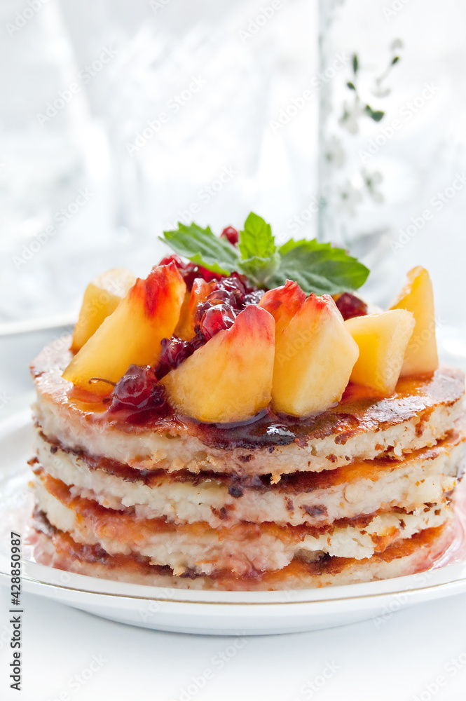 Cheese casserole with peach slices and currant jam. Sweet dessert Cheese casserole with peach slices and currant jam. Sweet dessert
