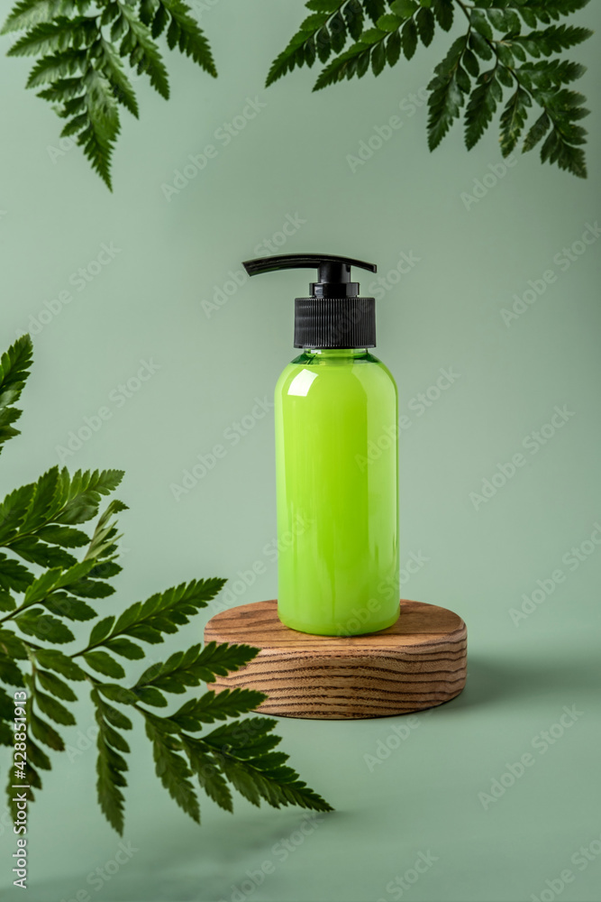 Bottle with dispenser on podium and pastel background. Cosmetic container mockup with place for text. Natural skincare beauty product concept. Bottle with dispenser on podium and pastel background. Cosmetic container mockup with place for text. Natural skincare beauty product concept.