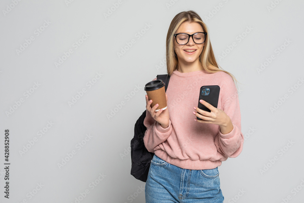 Young beautiful woman using smart phone isolated on white background Young beautiful woman using smart phone isolated on white background
