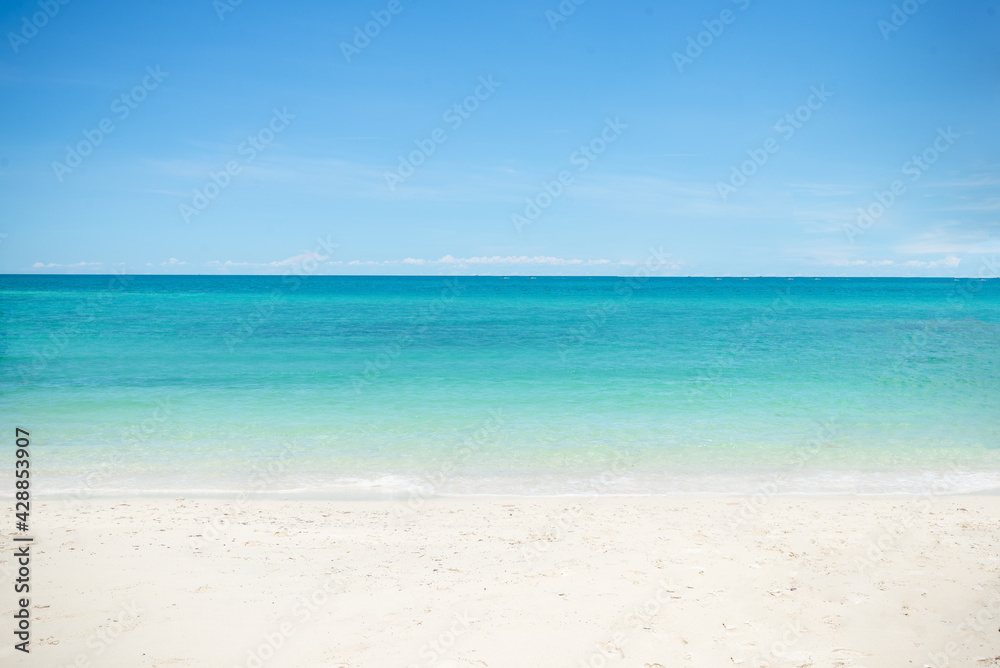 Beautiful wide of seascape with blue sky at daylight. Sand of beach smooth Sea.