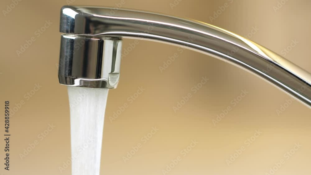 Water running from Faucet closeup. Nobody Water running from Faucet closeup. Nobody