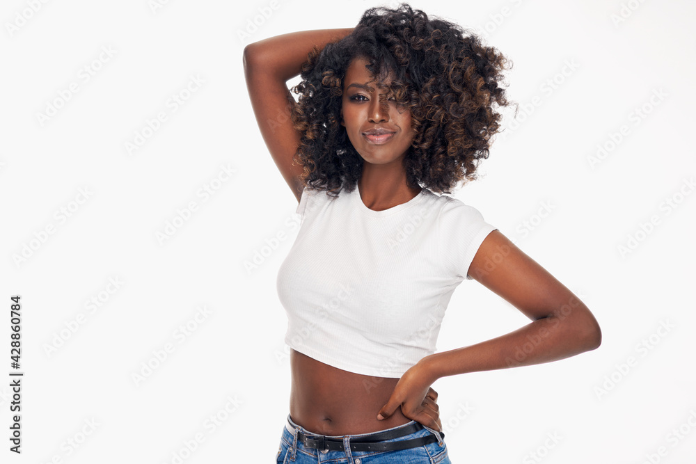 Attractive young black woman playing with her afro isolated on white background Attractive young black woman playing with her afro isolated on white background