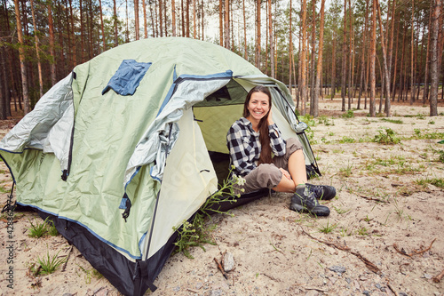 girl hiker in a tent