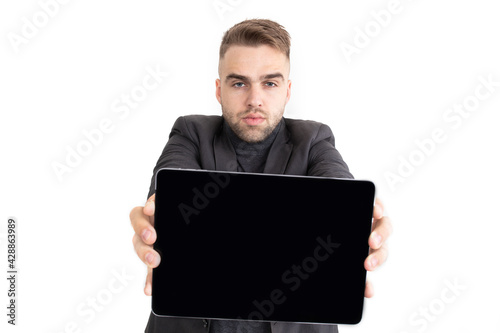 The guy shows a new tablet on a white background