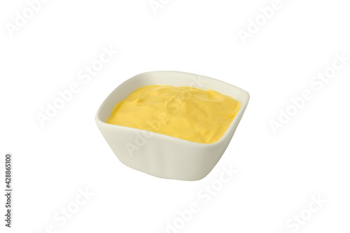 Bowl with cheese sauce on white background.