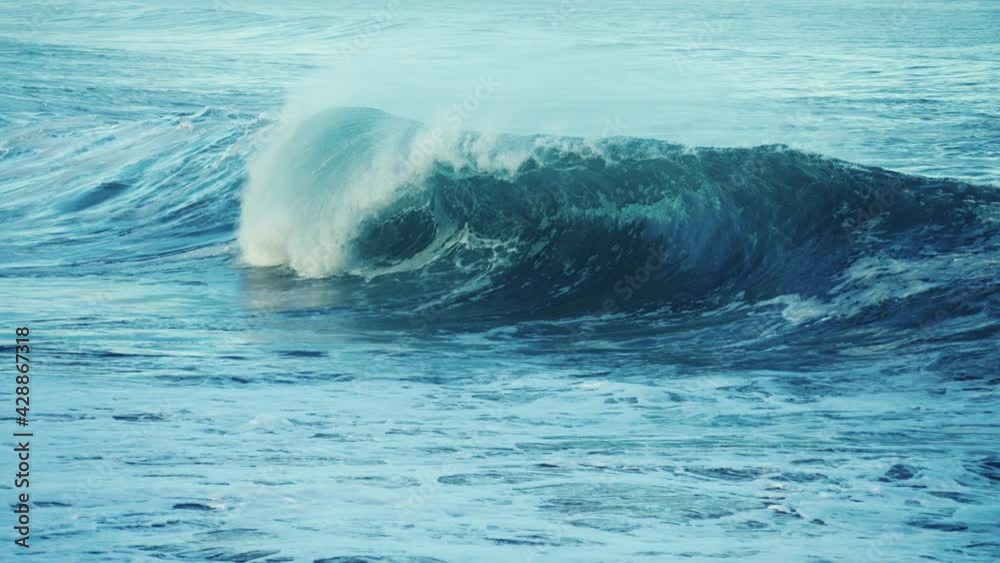Beautiful slow motion slo mo ocean waves crashing and breaking off the sea shore in Hawaii suggests power, magnificence, spray, freshness, storm. Beautiful slow motion slo mo ocean waves crashing and breaking off the sea shore in Hawaii suggests power, magnificence, spray, freshness, storm.