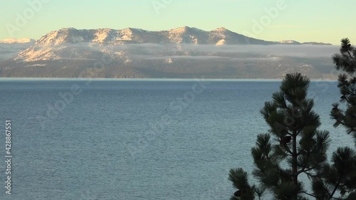 Beautiful establishing shot of Lake Tahoe, California, Nevada, Sierras in winter with snow.