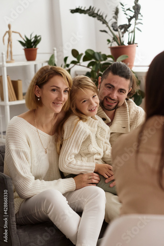 family with a child at a psychotherapist at the reception