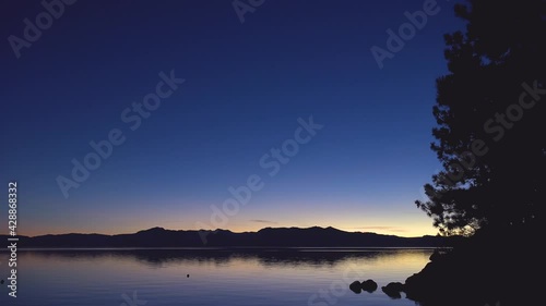 Beautiful establishing shot of Lake Tahoe, California, Nevada, Sierras at dawn or dusk.