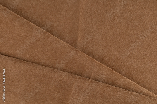 curtain fabric, copper-colored canvas, folded diagonally