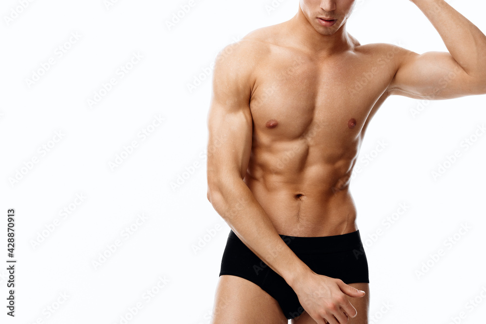 attractive man with an athletic physique and cubes on his stomach bodybuilder fitness attractive man with an athletic physique and cubes on his stomach bodybuilder fitness