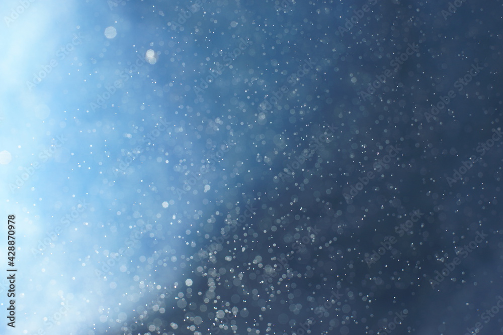 Background with blurred drops and gradient from blue to blue
