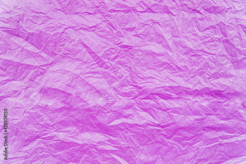 The texture of crumpled pink paper. Paper for wrapping gifts and flowers.