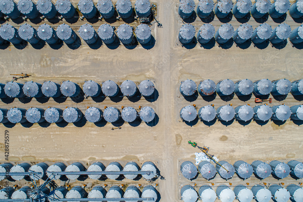 Aerial Overhead view of massive Grain Storage facility. Rows and Rows of Silos