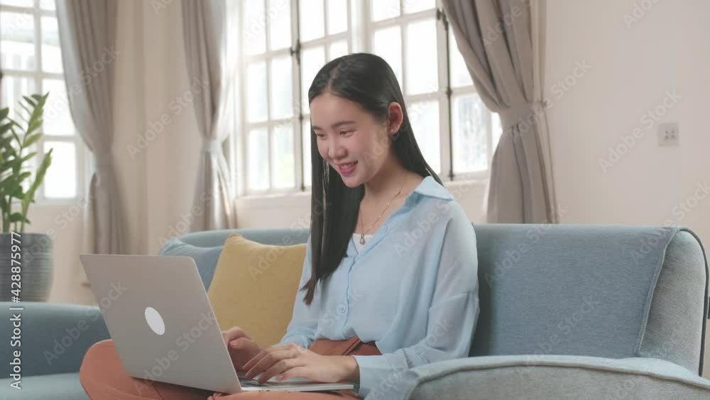 Woman Sitting Sofa And Use Laptop Computer In Living Room
Woman Sitting Sofa And Use Laptop Computer In Living Room