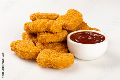 Fried chicken nuggets isolated on the white background. photo