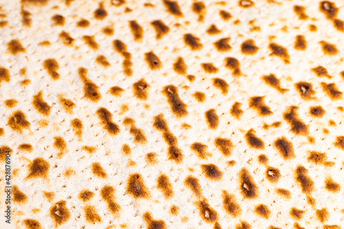 background texture matzah  unleavened bread. Matzo top view