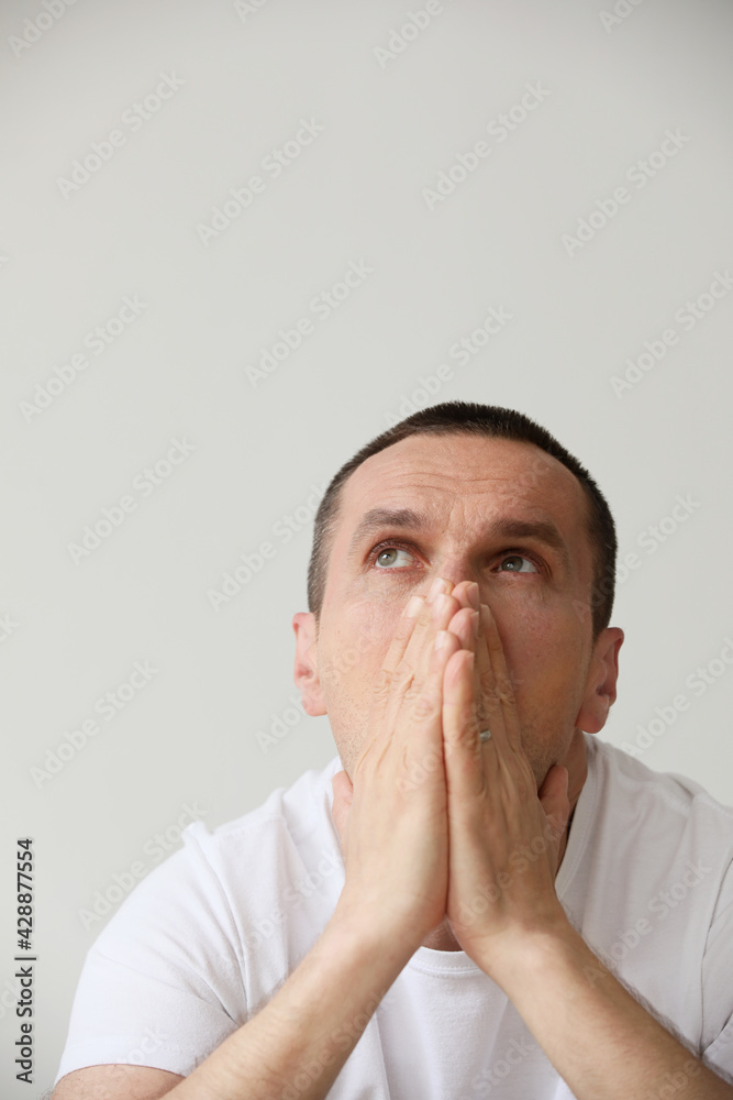 Headshot of young man suffering mental problems. Headshot of young man suffering mental problems.