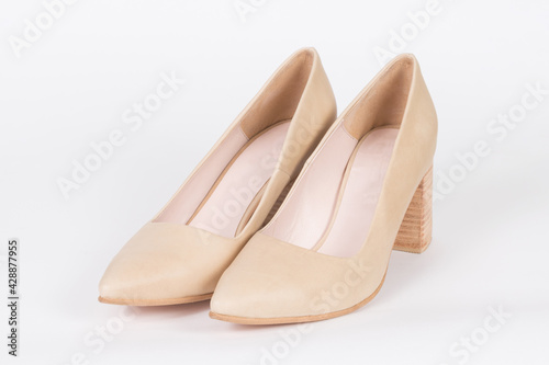 Beige shoes for women on white background