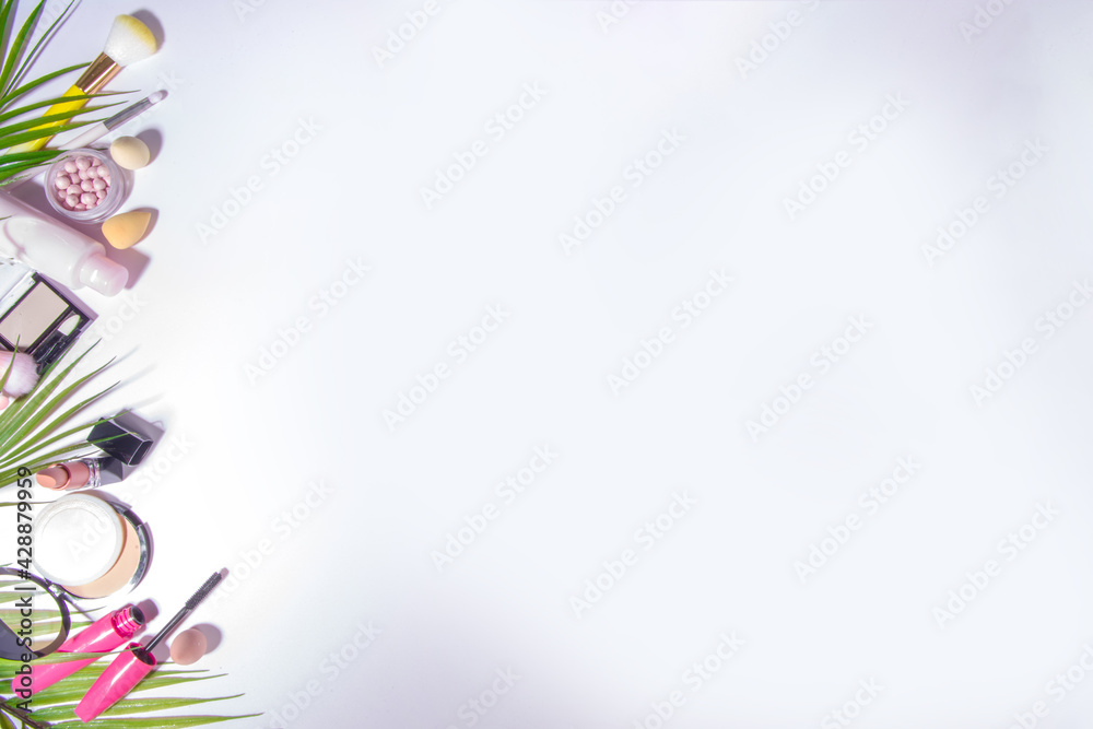 Summer decorative cosmetic set, professional Makeup and accessories on white background with palm leaves flatlay top view copy space Summer decorative cosmetic set, professional Makeup and accessories on white background with palm leaves flatlay top view copy space