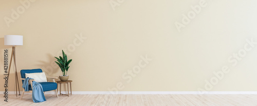 Empty room with armchair on empty beige wall background. Modern minimalist interior with armchair, plant, table and a lamp. 3d rendering.