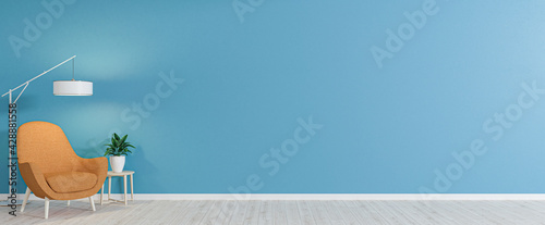 Empty room with armchair on empty blue wall background. Modern minimalist interior with armchair, plant, table and a lamp. 3d rendering.