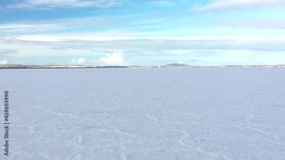2020 - Excellent aerial shot of the frozen over Lake Greenly on Eyre Peninsula, South Australia shadowed by clouds. 2020 - Excellent aerial shot of the frozen over Lake Greenly on Eyre Peninsula, South Australia shadowed by clouds.
