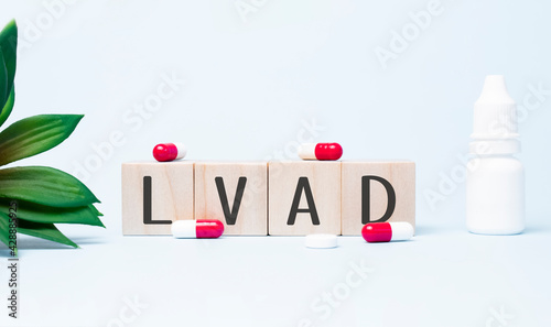 lvad. Text abbreviation on wood cubes blocks on light blue background. Most commonly diagnosed mental disorder of children. Close up. photo