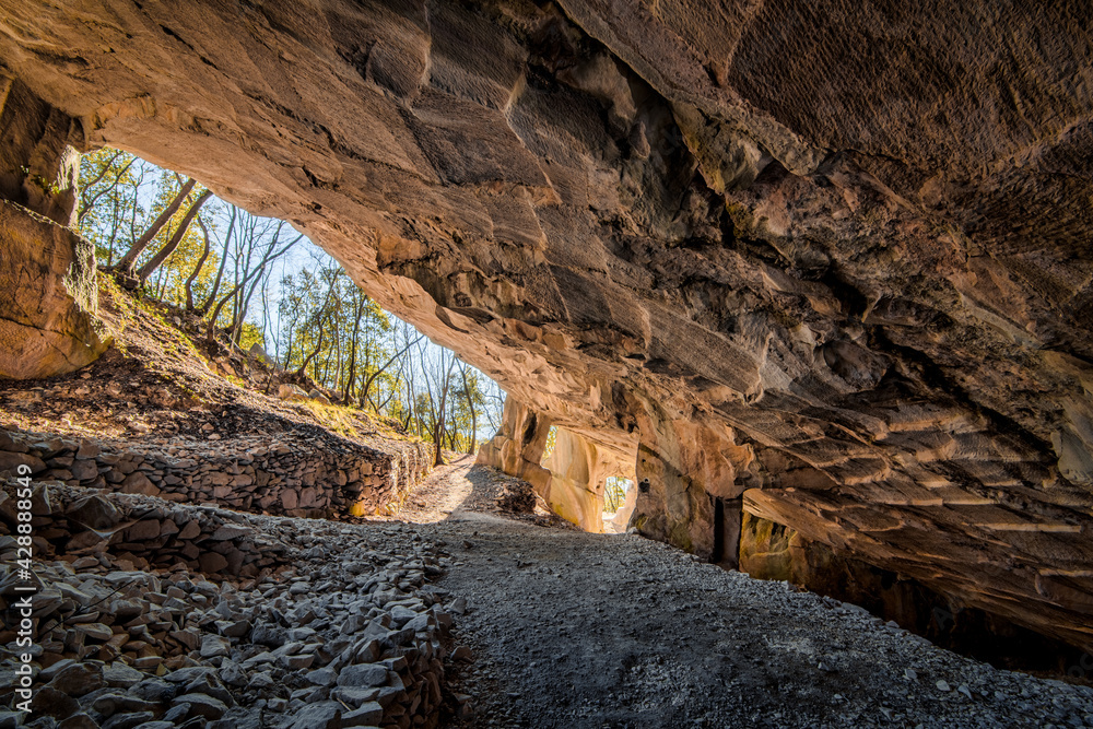 Obraz premium Beautiful Limestone cave, Old Oolitic stone quarries in Massone, The extracted stone, called 