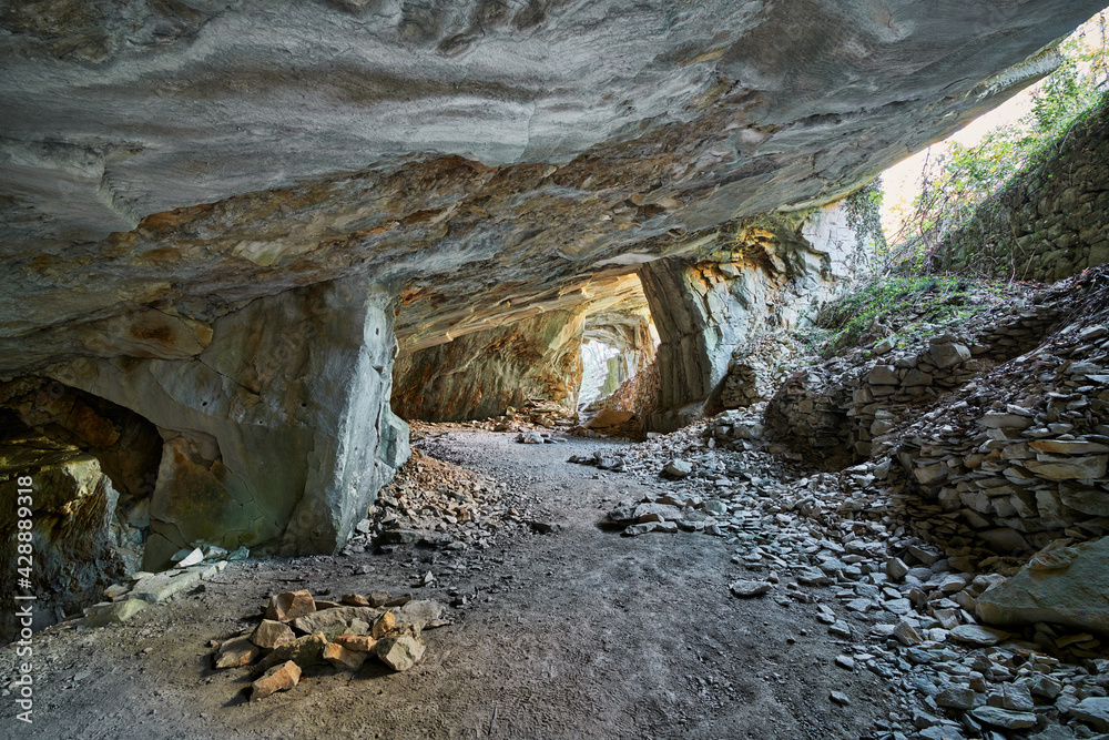 Beautiful Limestone cave, Old Oolitic stone quarries in Massone, The extracted stone, called 