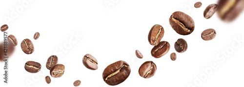 Foto Dark aromatic roasts beans coffee levitate on white background with copyspace