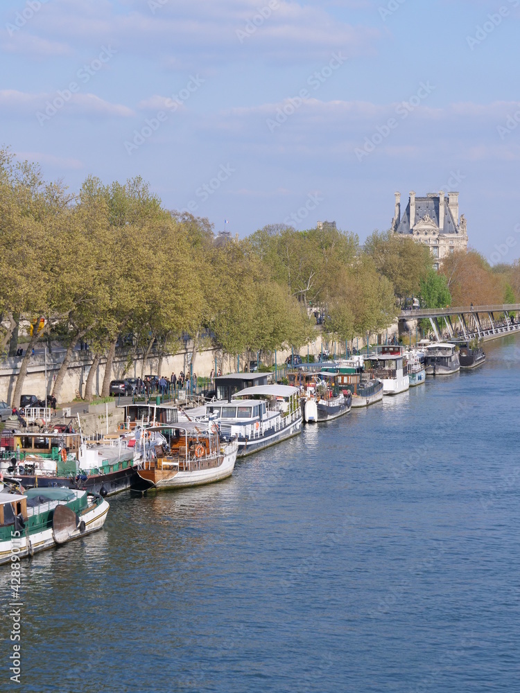 Some barges parked in Paris along the quay. The floating flat of Paris, the 17th April 2021.