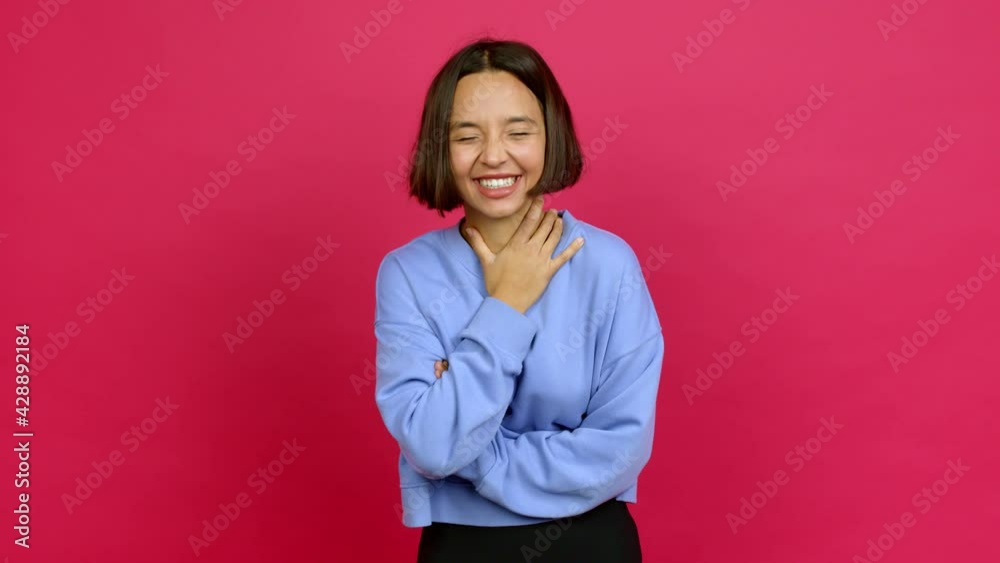 Young latin woman keeping the arms crossed while smiling over isolated background Young latin woman keeping the arms crossed while smiling over isolated background