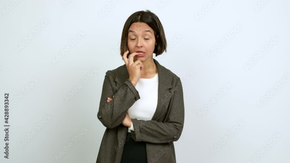 Young latin woman having doubts and questioning an idea over isolated background Young latin woman having doubts and questioning an idea over isolated background