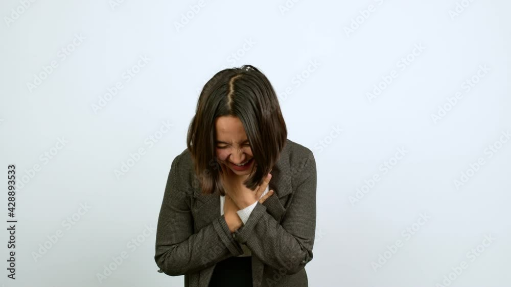 Young latin woman smiling a lot while covering mouth over isolated background Young latin woman smiling a lot while covering mouth over isolated background