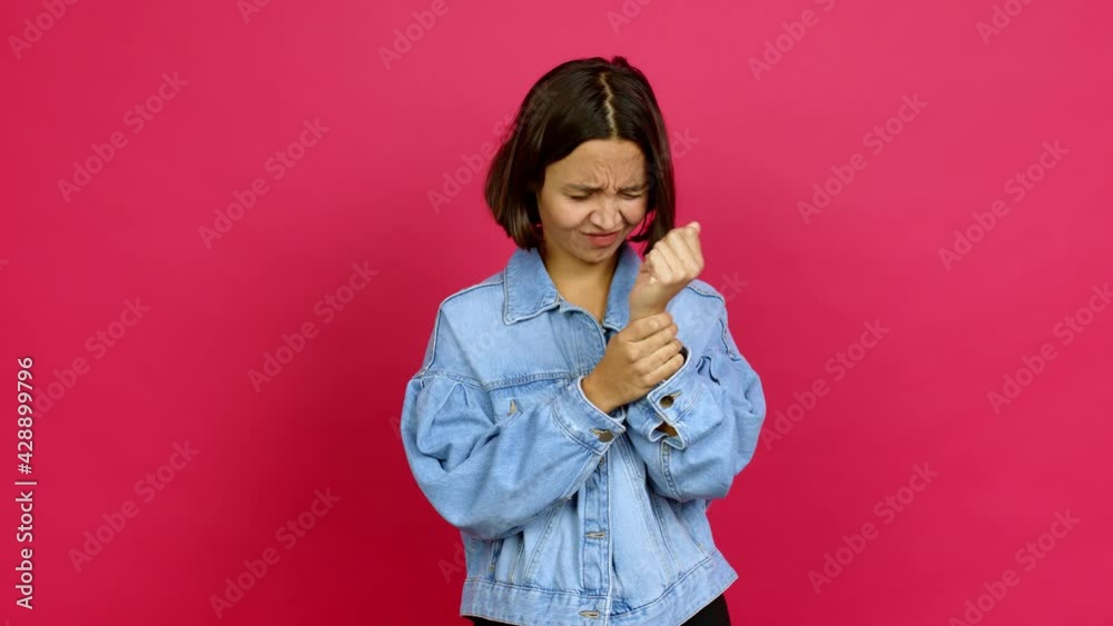 Young latin woman with pain in hand over isolated background Young latin woman with pain in hand over isolated background