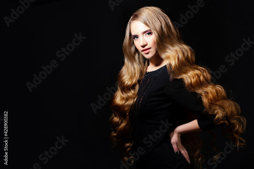 Luxurious golden curls, portrait of a young beautiful woman with beautiful hair,