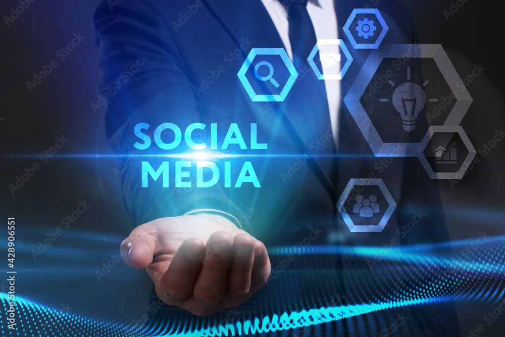 Business, Technology, Internet and network concept. Young businessman working on a virtual screen of the future and sees the inscription: Social media