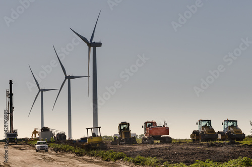 Row of three modern windmills in the countryside near Tarariras, Colonia. photo