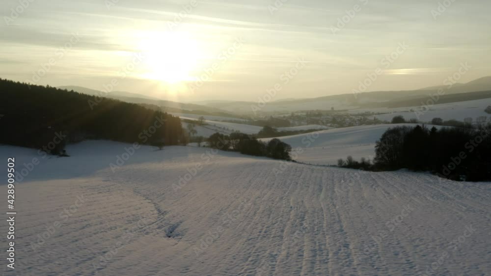 Snowy field in a winter countryside in Czechia at sunset. Snowy field in a winter countryside in Czechia at sunset.