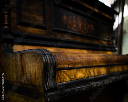 close up of old wood piano