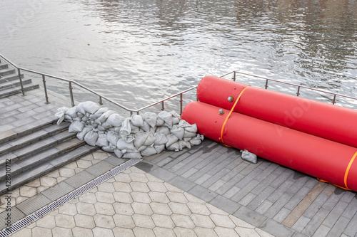 Fototapeta Water-filled booms and sandbags