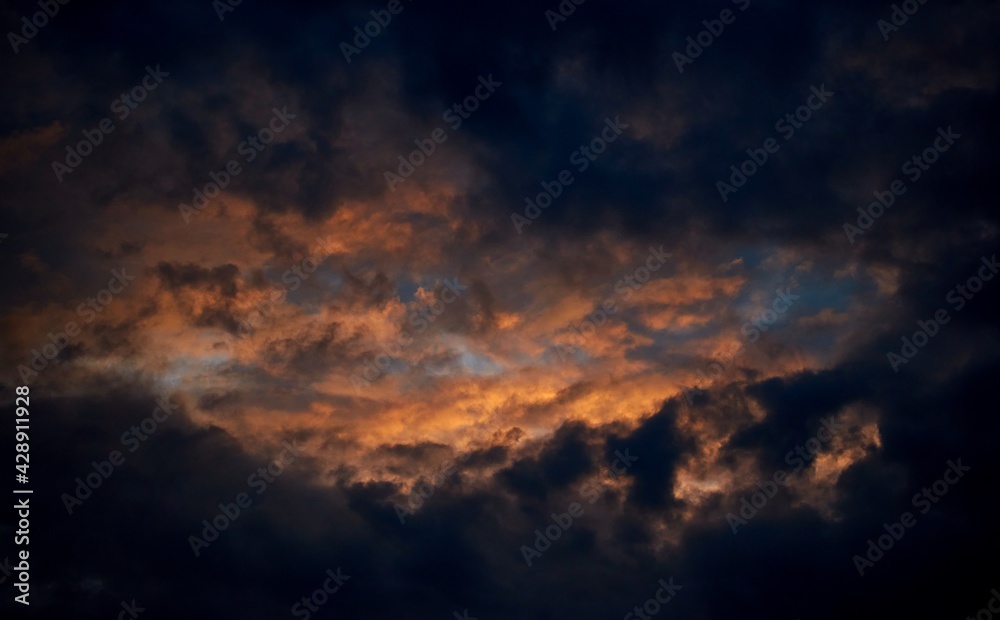 Background of the dramatic cloudy sky in the dusk Background of the dramatic cloudy sky in the dusk