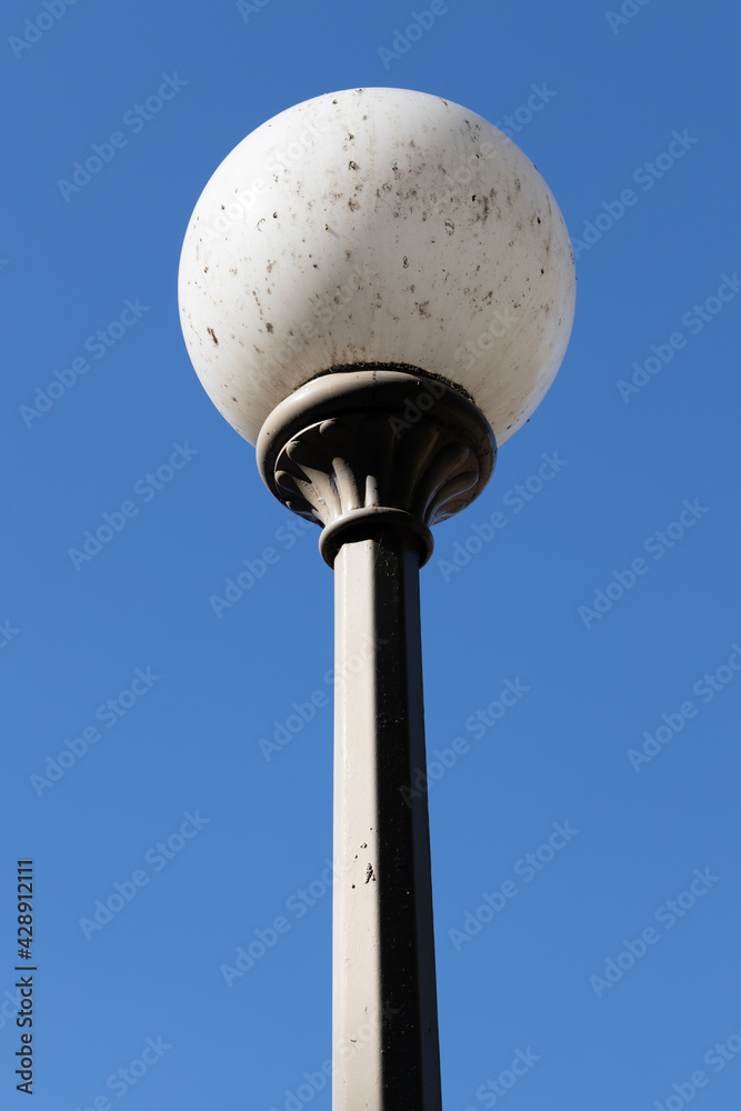 Beautiful white street lamp against a beautiful blue sky in a Sydney Park NSW Australia Beautiful white street lamp against a beautiful blue sky in a Sydney Park NSW Australia