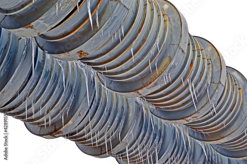 large metal welding pipe with icicles and many rings isolated on white background, vintage weld heating system