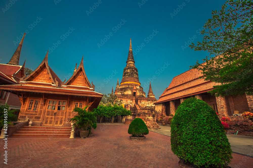 Fototapeta premium Background of old Buddha statues in Thai religious attractions in Ayutthaya Province, allowing tourists to study their history and take public photos.